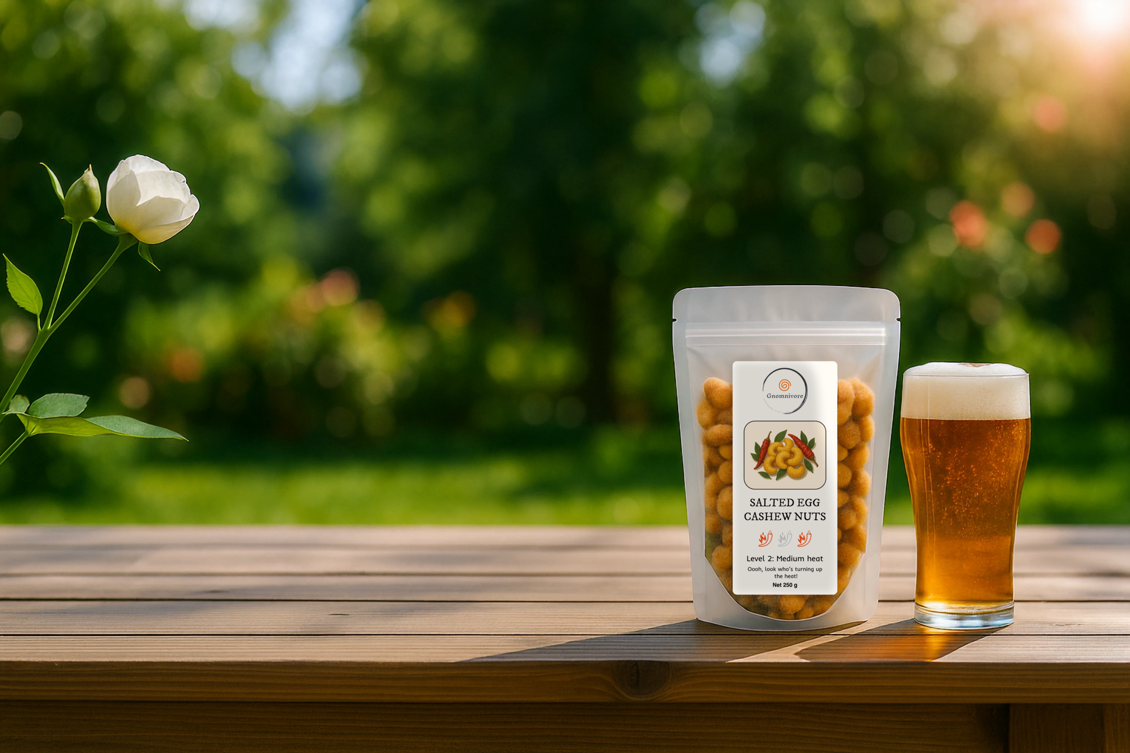 Packaged garden nuts with a glass of beer on a wooden table outdoors.