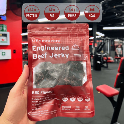 Engineered Beef jerky package shot in the gym with nutrtional macros on top.